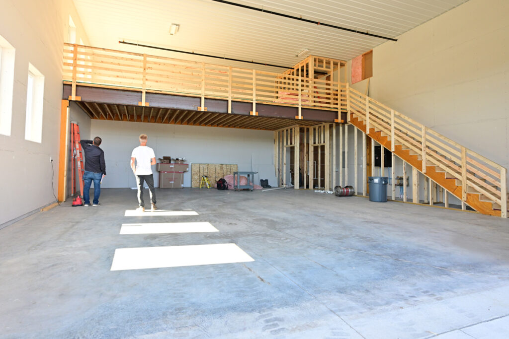 Two men on the jobsite, discussing the construction project that is under way.