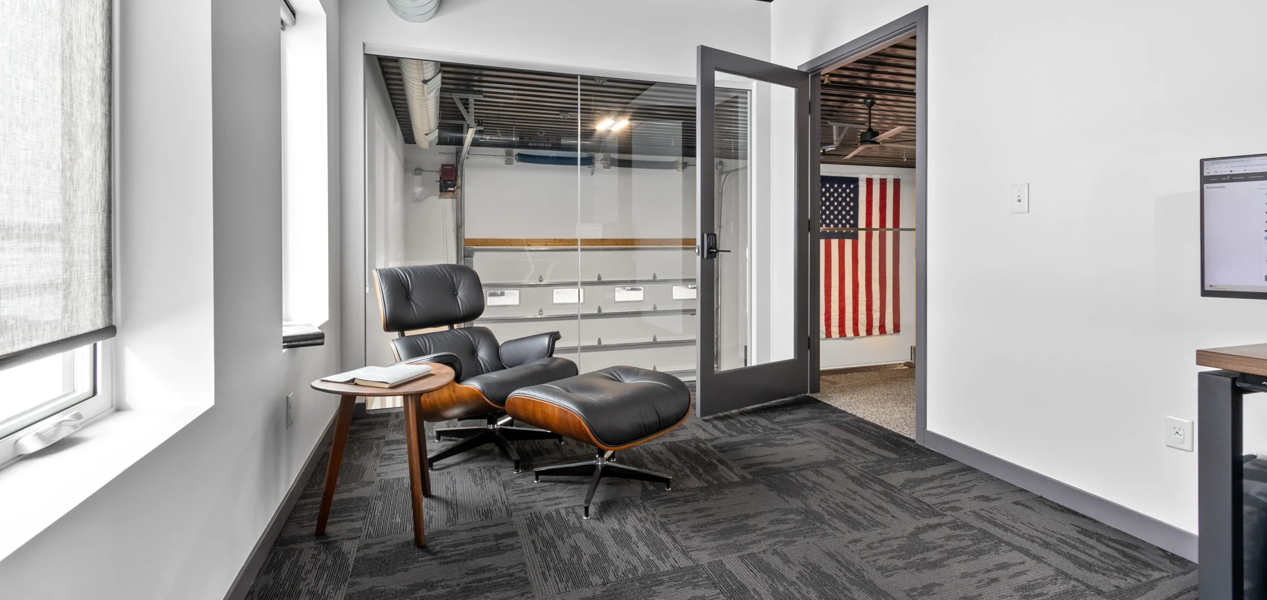 An office with a chair and ottoman.