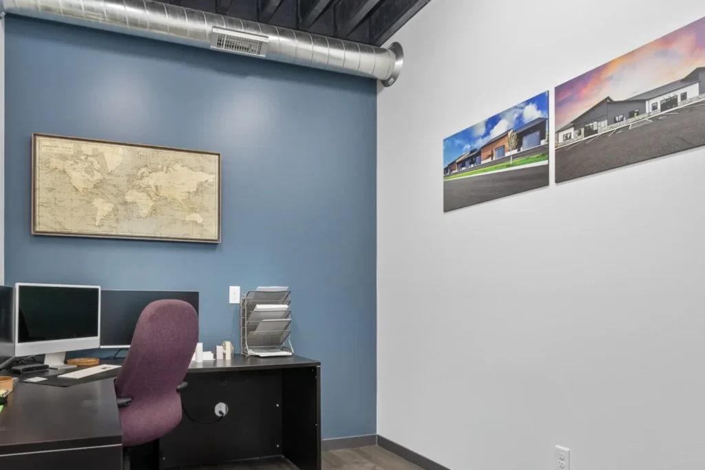An interior office space with one blue wall.